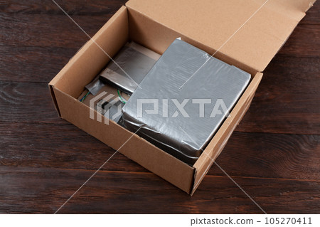 Mail bomb. Improvised Explosive Device with plastic explosive C-4 and cell phone module in package Mail bomb. Improvised Explosive Device with plastic explosive C-4 and cell phone module in package 105270411
