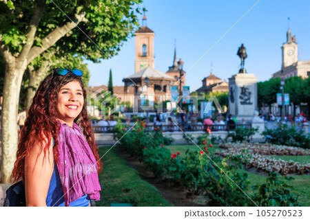 Plaza de Cervantes in Alcala de Henares tourism heritage. Hispanic mid-female journey confident 105270523