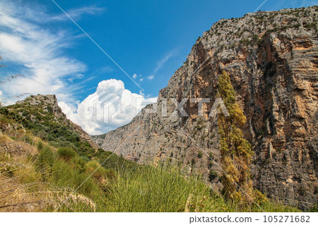 Raganello Gorge with Devil bridge in Civita, Calabria, Italy. Beautiful mountain landscape of the Pollino National Park Raganello Gorge with Devil bridge in Civita, Calabria, Italy. Beautiful mountain landscape of the Pollino National Park 105271682