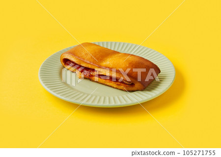 Lanche misto traditional portuguese sandwich with cheese and chorizo. Tasty breakfast over yellow background. Lanche misto traditional portuguese sandwich with cheese and chorizo. Tasty breakfast over yellow background. 105271755