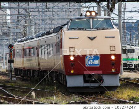 [Driver blurred out] Kiha 183 series diesel car Slant Nose leading car from JR Hakodate station area road 105274247