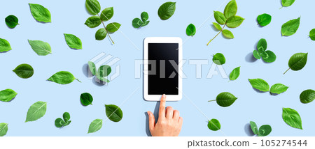 Green leaves with a tablet compute 105274544