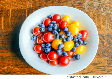 Cherry tomatoes and blueberries 105274989