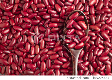 Close-up photo of several red kidney beans and wooden spoon,top view,flay lay,top-down. Close-up photo of several red kidney beans and wooden spoon,top view,flay lay,top-down. 105275687