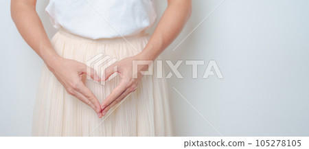 Woman hand heart shape over abdomen. Ovarian and Cervical cancer, Endometriosis, Hysterectomy, Uterine fibroids, Reproductive, menstruation, Stomach, Pregnancy and Sexual Transmitted disease concept Woman hand heart shape over abdomen. Ovarian and Cervical cancer, Endometriosis, Hysterectomy, Uterine fibroids, Reproductive, menstruation, Stomach, Pregnancy and Sexual Transmitted disease concept 105278105