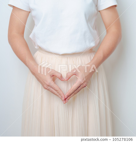 Woman hand heart shape over abdomen. Ovarian and Cervical cancer, Endometriosis, Hysterectomy, Uterine fibroids, Reproductive, menstruation, Stomach, Pregnancy and Sexual Transmitted disease concept Woman hand heart shape over abdomen. Ovarian and Cervical cancer, Endometriosis, Hysterectomy, Uterine fibroids, Reproductive, menstruation, Stomach, Pregnancy and Sexual Transmitted disease concept 105278106