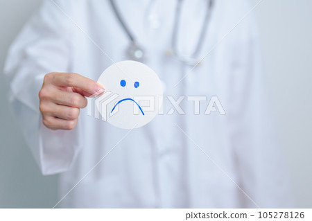 Doctor show Unhappy sad face paper, Mental health Assessment, Psychology, Health Wellness, Negative Feedback, Customer Review, Bad Experience, Satisfaction Survey, World Mental Health day concept 105278126