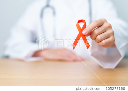 Doctor with Orange Ribbon for Leukemia, Kidney cancer day, world Multiple Sclerosis, CRPS, Self Injury Awareness month. Healthcare and word cancer day concept 105278168