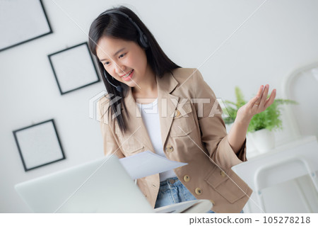 Beautiful young asian business woman using laptop computer working from home for video. Beautiful young asian business woman using laptop computer working from home for video. 105278218