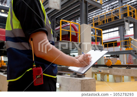 Closeup hands young engineer man or worker checking electric train for planning maintenance. Closeup hands young engineer man or worker checking electric train for planning maintenance. 105278293