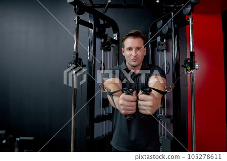 Young caucasian man workout with strength training and determination with fitness gym. 105278611