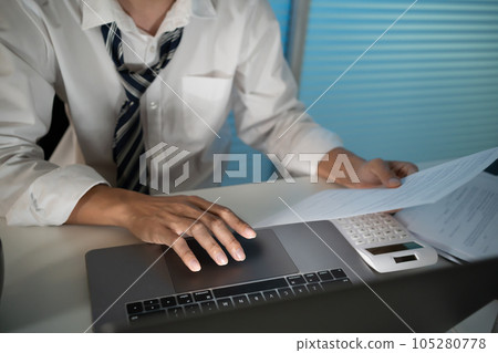 Asian businessman working on laptop in night office. dark late night at home office online meeting work hard concept. 105280778