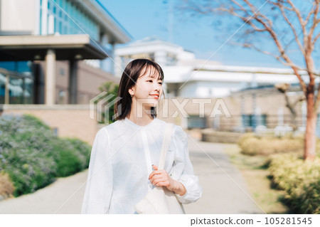 College student walking on campus College student walking on campus 105281545