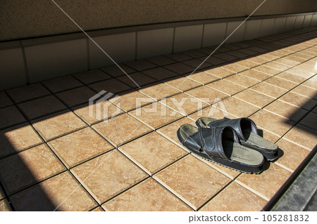 Tiled veranda and sandals for outdoor wear Tiled veranda and sandals for outdoor wear 105281832