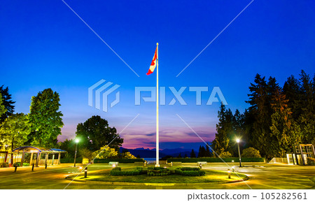 Flagpole with a Canadian Flag at University of British Columbia in Vancouver at sunset Flagpole with a Canadian Flag at University of British Columbia in Vancouver at sunset 105282561