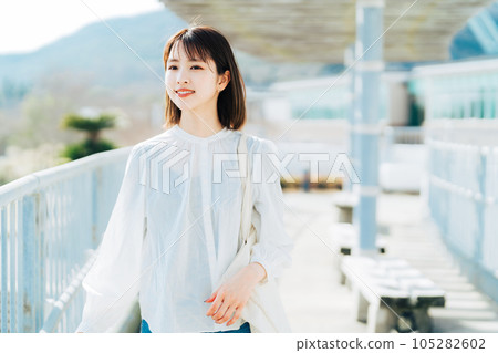 College student walking on campus 105282602