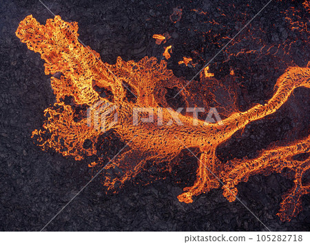 Aerial view of spreading melted lava from volcano. Aerial view of spreading melted lava from volcano. 105282718