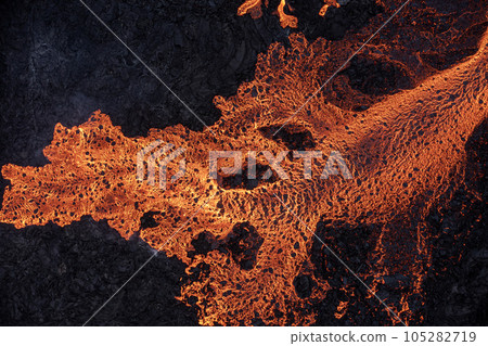 Aerial view of spreading melted lava from volcano. Aerial view of spreading melted lava from volcano. 105282719