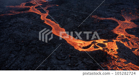 Aerial view of spreading melted lava from volcano. 105282724