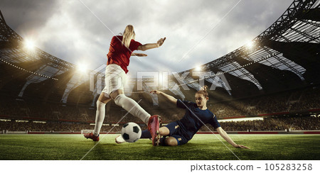 WOrld football cup. Two women, professional football players competing for the win, playing on 3D open air arena 105283258