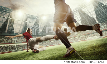 Dynamic image of female football players in motion during match, game. Woman hitting ball and falling down. 3d arena, blurred audience Dynamic image of female football players in motion during match, game. Woman hitting ball and falling down. 3d arena, blurred audience 105283261