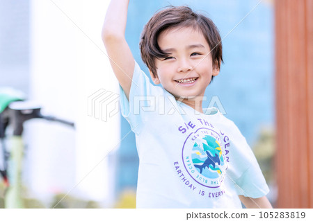 happy asian child girl smiling with her arms raised 105283819