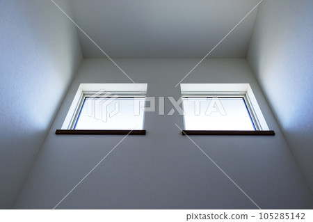 Two rectangular daylighting windows on a white wall 105285142