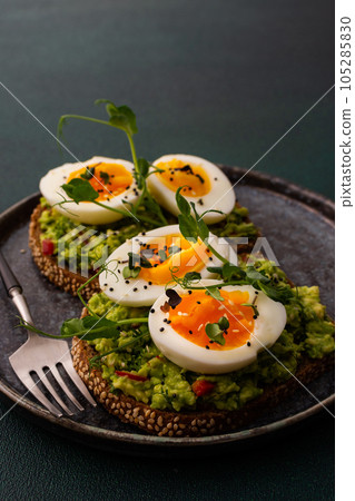 Guacamole sandwiches with boiled eggs Guacamole sandwiches with boiled eggs 105285830