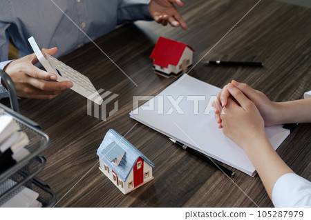Real Estate Agent explain insurance and agreement contract to client and calculate costs before sign contract purchase house Real Estate Agent explain insurance and agreement contract to client and calculate costs before sign contract purchase house 105287979