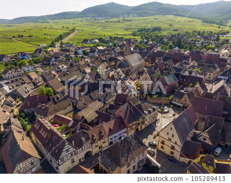 Aerial Drone Shot of Eguisheim village in the Alsace province, France. Picturesque village in a Sunny Summer Day 105289413
