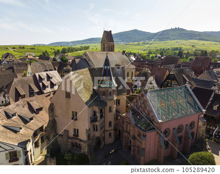 Aerial Drone Shot of Eguisheim village in the Alsace province, France. Picturesque village in a Sunny Summer Day Aerial Drone Shot of Eguisheim village in the Alsace province, France. Picturesque village in a Sunny Summer Day 105289420