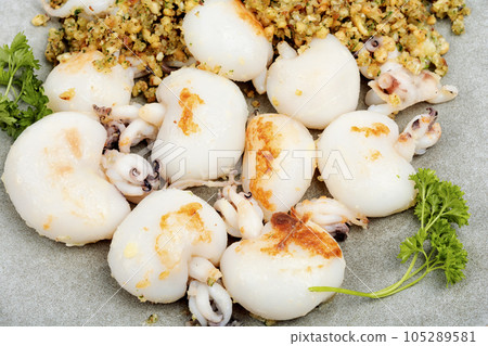 Grilled squids with nuts. Grilled squids with nuts. 105289581