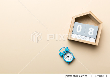 March 8st. Image of March 8 wooden block calendar on colored background. Summer day. Empty space for text 105290091