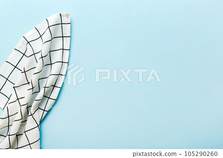 top view with white empty kitchen napkin isolated on table background. Folded cloth for mockup with copy space, Flat lay. Minimal style top view with white empty kitchen napkin isolated on table background. Folded cloth for mockup with copy space, Flat lay. Minimal style 105290260