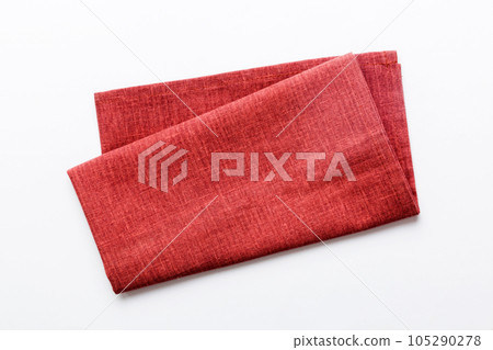 top view with red empty kitchen napkin isolated on table background. Folded cloth for mockup with copy space, Flat lay. Minimal style top view with red empty kitchen napkin isolated on table background. Folded cloth for mockup with copy space, Flat lay. Minimal style 105290278