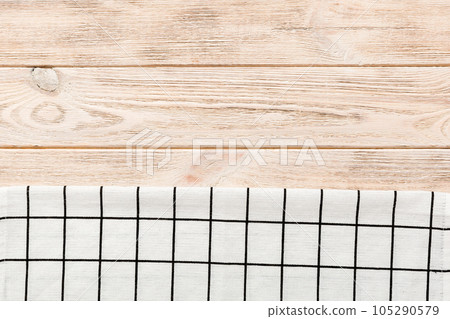 top view with white empty kitchen napkin isolated on table background. Folded cloth for mockup with copy space, Flat lay. Minimal style top view with white empty kitchen napkin isolated on table background. Folded cloth for mockup with copy space, Flat lay. Minimal style 105290579