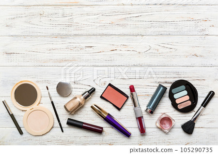 Professional makeup tools. Top view. Flat lay. Beauty, decorative cosmetics. Makeup brushes set and color eyeshadow palette on table background. Minimalistic style Professional makeup tools. Top view. Flat lay. Beauty, decorative cosmetics. Makeup brushes set and color eyeshadow palette on table background. Minimalistic style 105290735