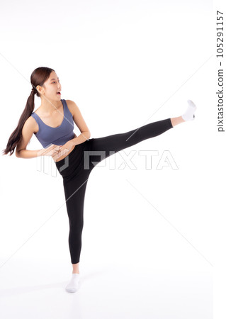 Portrait beautiful young asian woman in sportswear workout with kick and exercise isolated. Portrait beautiful young asian woman in sportswear workout with kick and exercise isolated. 105291157