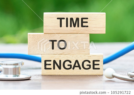 Wooden blocks with words time to engage. Business concept Wooden blocks with words time to engage. Business concept 105291722