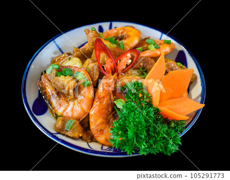 Salt fried shrimp with sauce and vegetables isolated on black backround 105291773