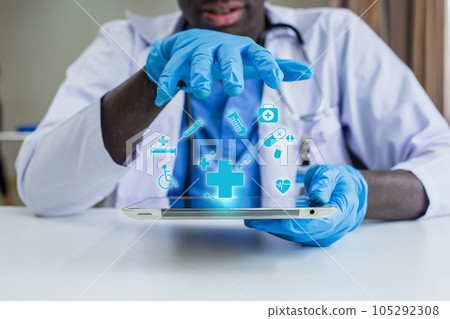 African American man doctor with medical icons on tablet analysis technology equipment. African American man doctor with medical icons on tablet analysis technology equipment. 105292308