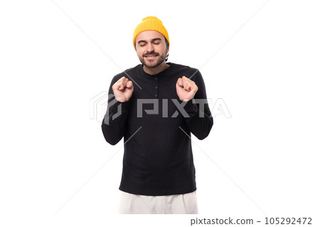 young brunet caucasian male model with beard dressed casually hopes on white background with copy 105292472