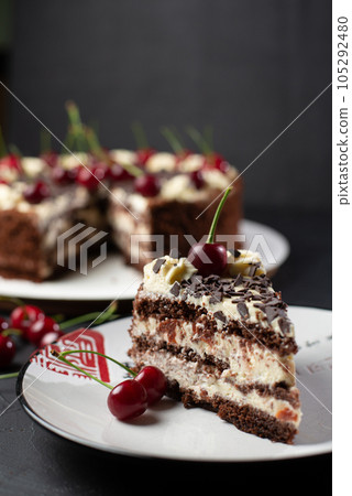 Cherry cake and chocolate on the background Cherry cake and chocolate on the background 105292480