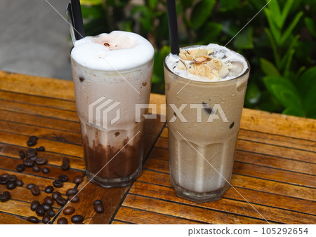 Coffee beverages on wooden table with coffee beans  105292654
