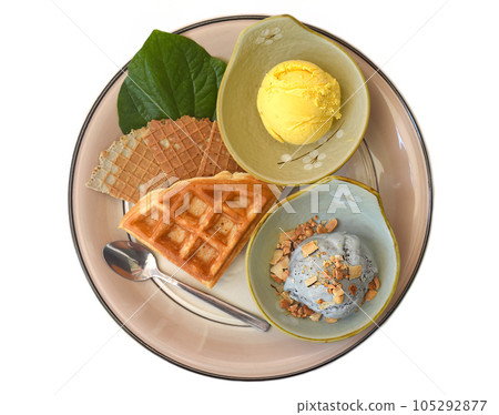 Two scoops of organic ice cream with Belgium waffle isolated on white background Two scoops of organic ice cream with Belgium waffle isolated on white background 105292877