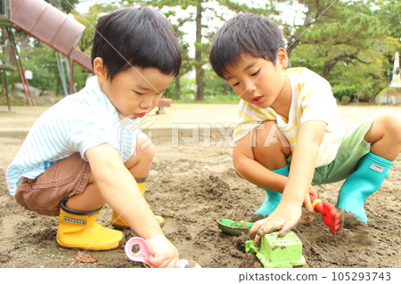 Children playing in the sandbox Children playing in the sandbox 105293743