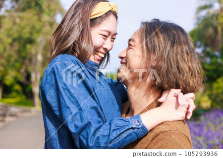 couple hugging and looking at each other couple hugging and looking at each other 105293936