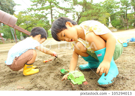Children playing in the sandbox Children playing in the sandbox 105294013