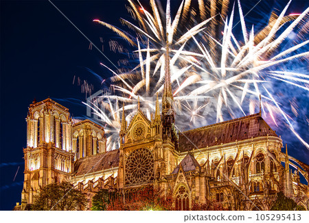 Celebratory fireworks over the Notre Dame de Paris, also known as Notre Dame Cathedral or simply Notre Dame, is a Gothic, Roman Catholic cathedral of Paris, France Celebratory fireworks over the Notre Dame de Paris, also known as Notre Dame Cathedral or simply Notre Dame, is a Gothic, Roman Catholic cathedral of Paris, France 105295413