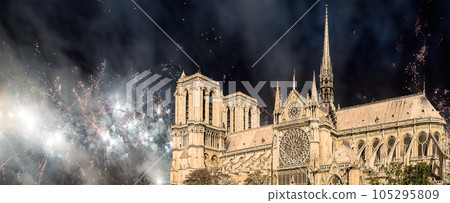Celebratory fireworks over the Notre Dame de Paris, also known as Notre Dame Cathedral or simply Notre Dame, is a Gothic, Roman Catholic cathedral of Paris, France 105295809